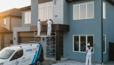 Professional exterior house painters working on a home in Brandon, FL with weather-resistant paint